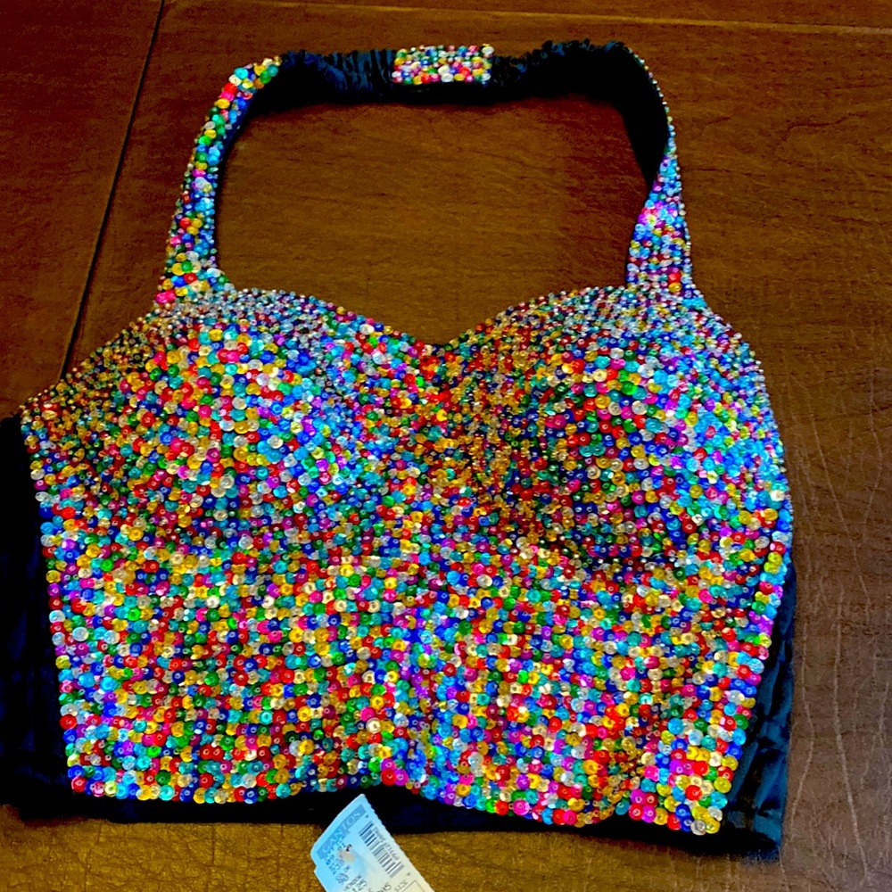 Multi color bustier with Velcro back closure and adjustable Velcro neck strap.